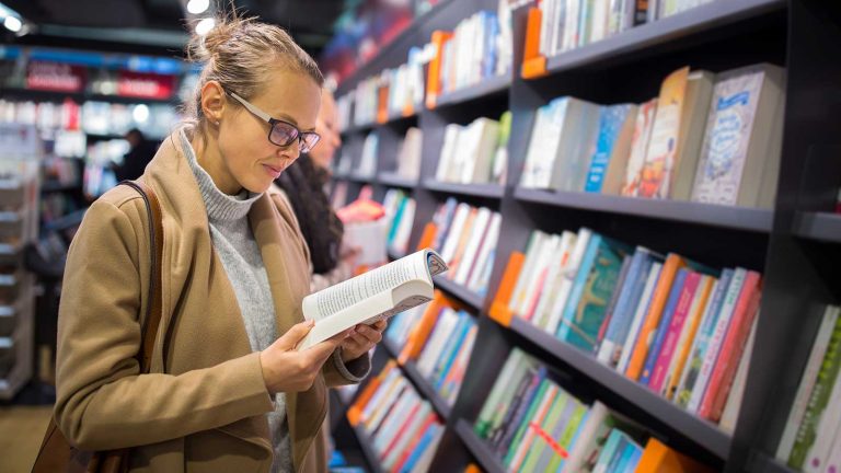 woman reading in bookstore